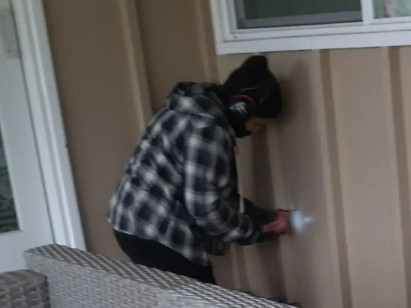 Professional electrician installing an exterior outlet in Ilion