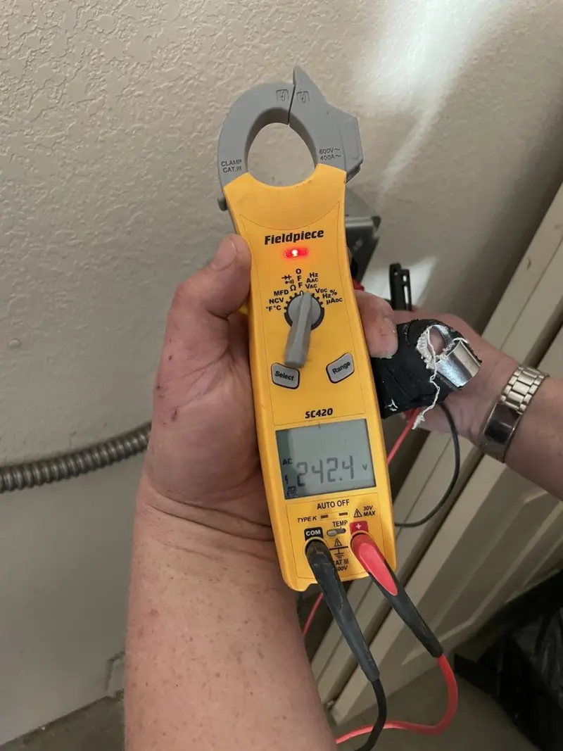 Voltage testing with clamp meter during Outlet Installation in Ilion